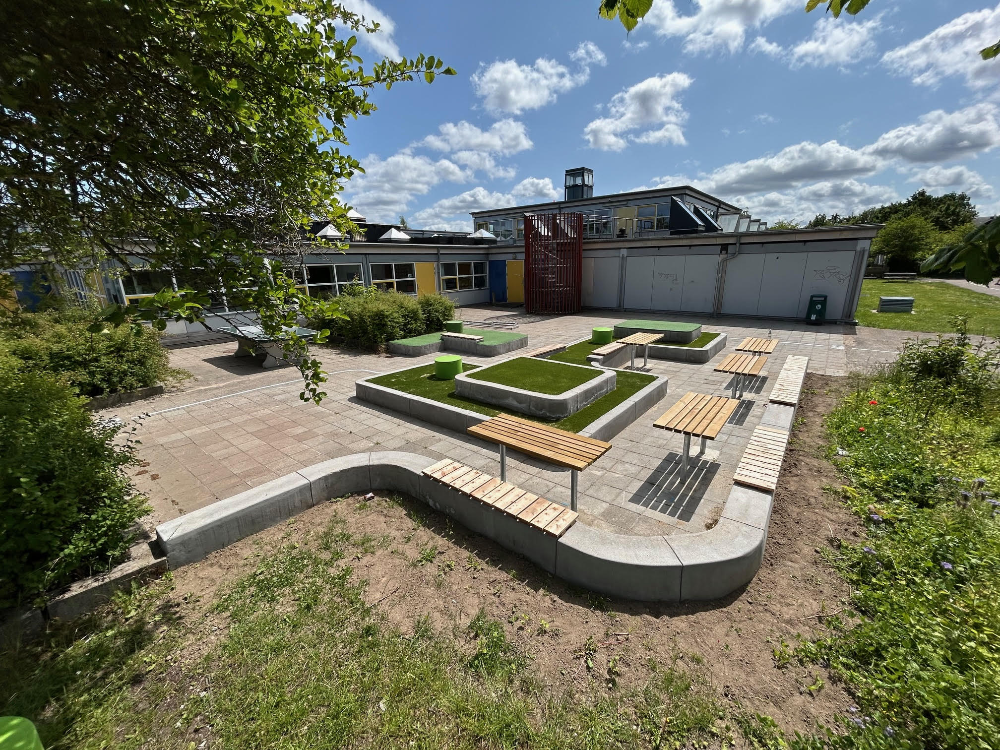 Picnic area with continuous concrete edging poured by a ScandiCurb slipform machine