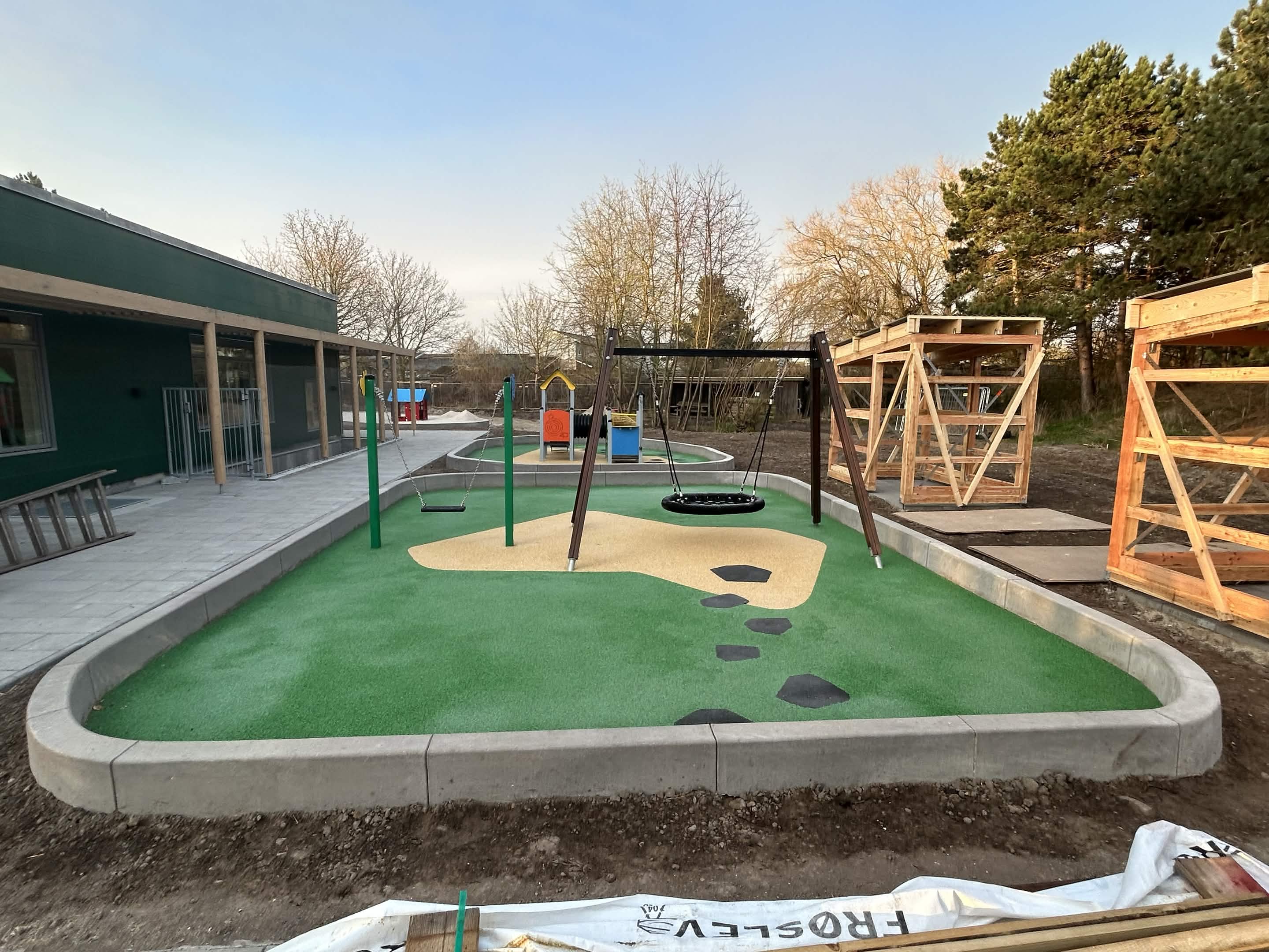 Custom concrete playground borders and play-area edging