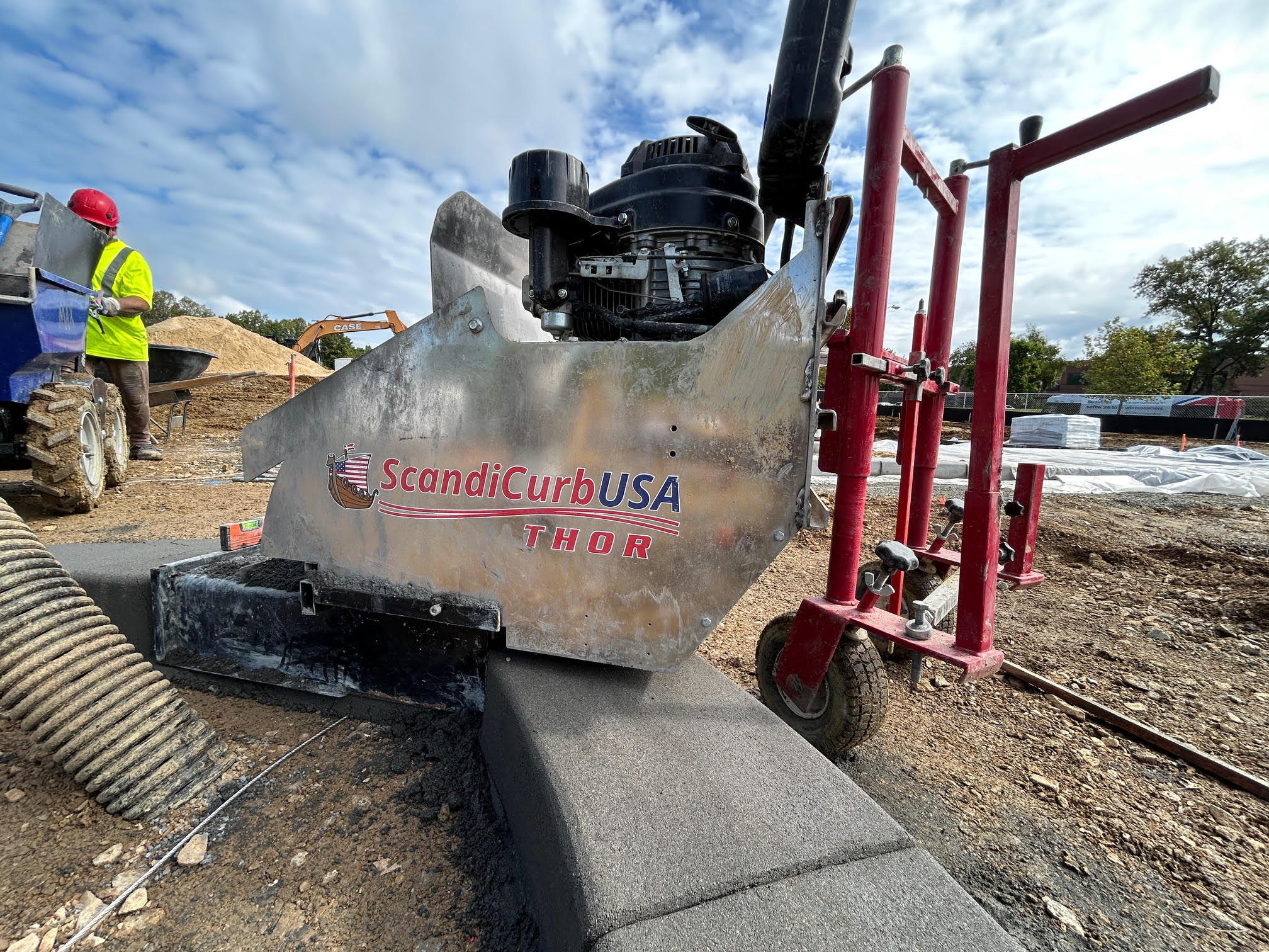 THOR slipform curbing machine working on site